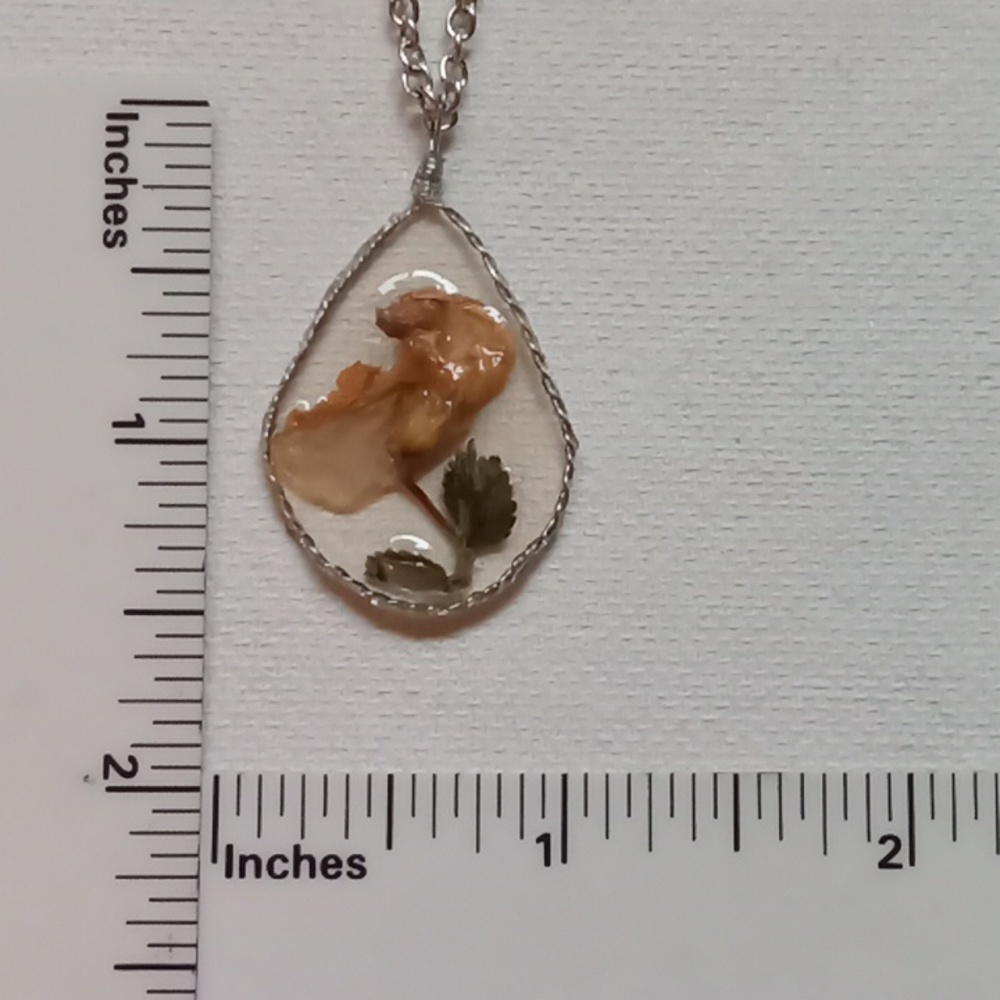 Floral necklace, amulet